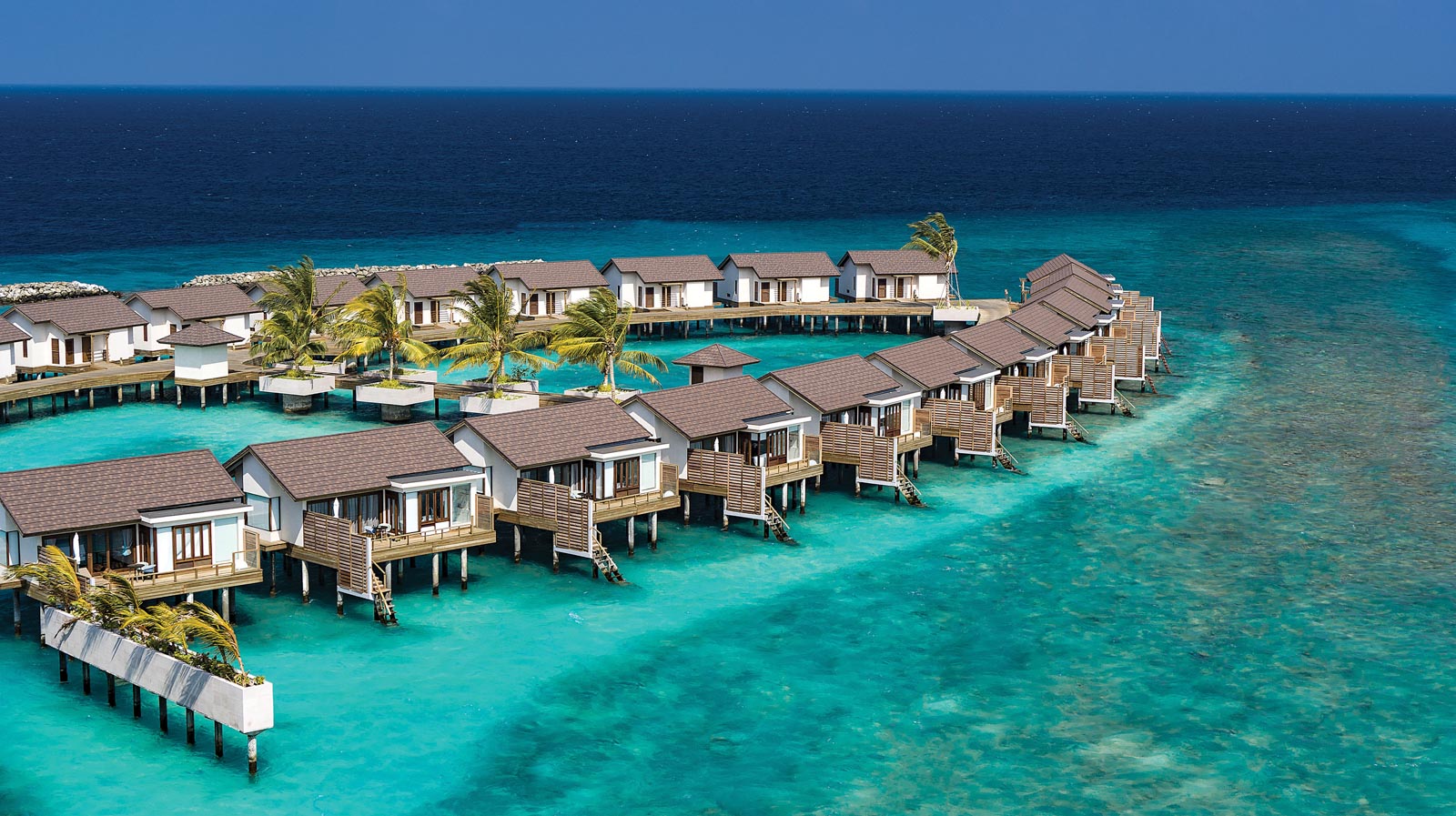 ATMOSPHERE KANIFUSHI MALDIVES - AERIALS AND GENERIC - Water Villa Jetty Aerial 03 - 02_2020