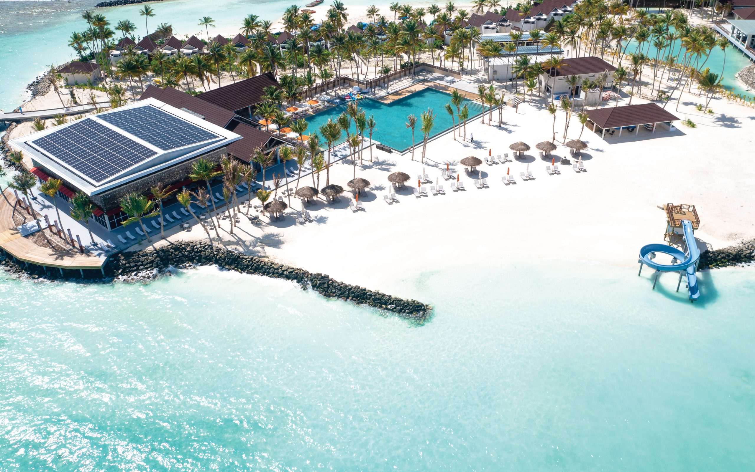 OBLU Xperience Ailafushi - Aerials and Generic - Arrival Jetty and Pool Bar Aerial 01