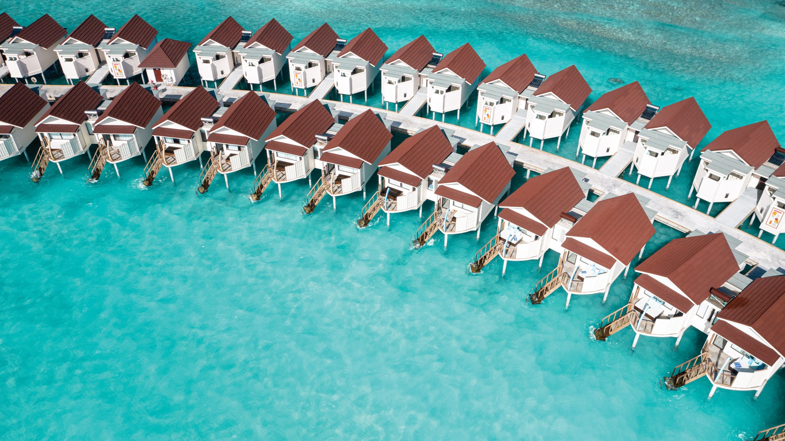OBLU Xperience Ailafushi - Aerials and Generic - Water Villas Aerial 01