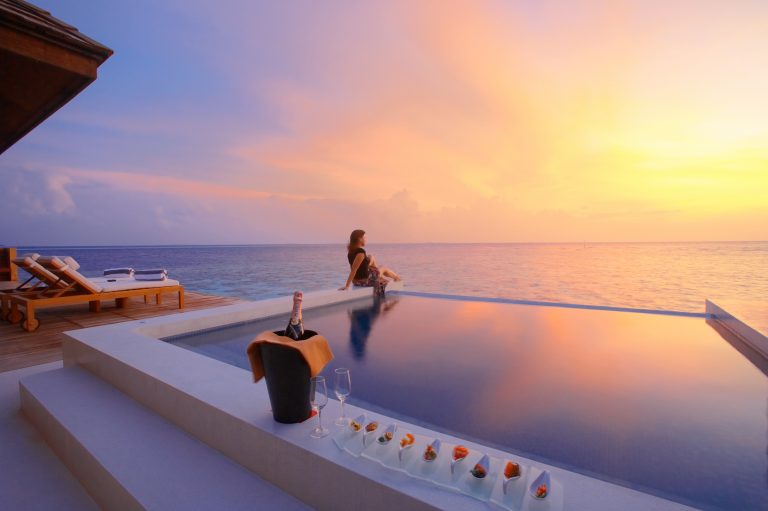 SunsetWaterSuite_Exterior_Sunset_withGirl