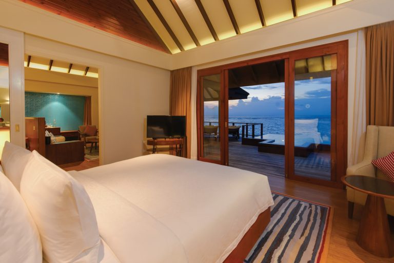 VARU BY ATMOSPHERE - VILLAS - WATER SUITE - BEDROOM VIEW - EVENING