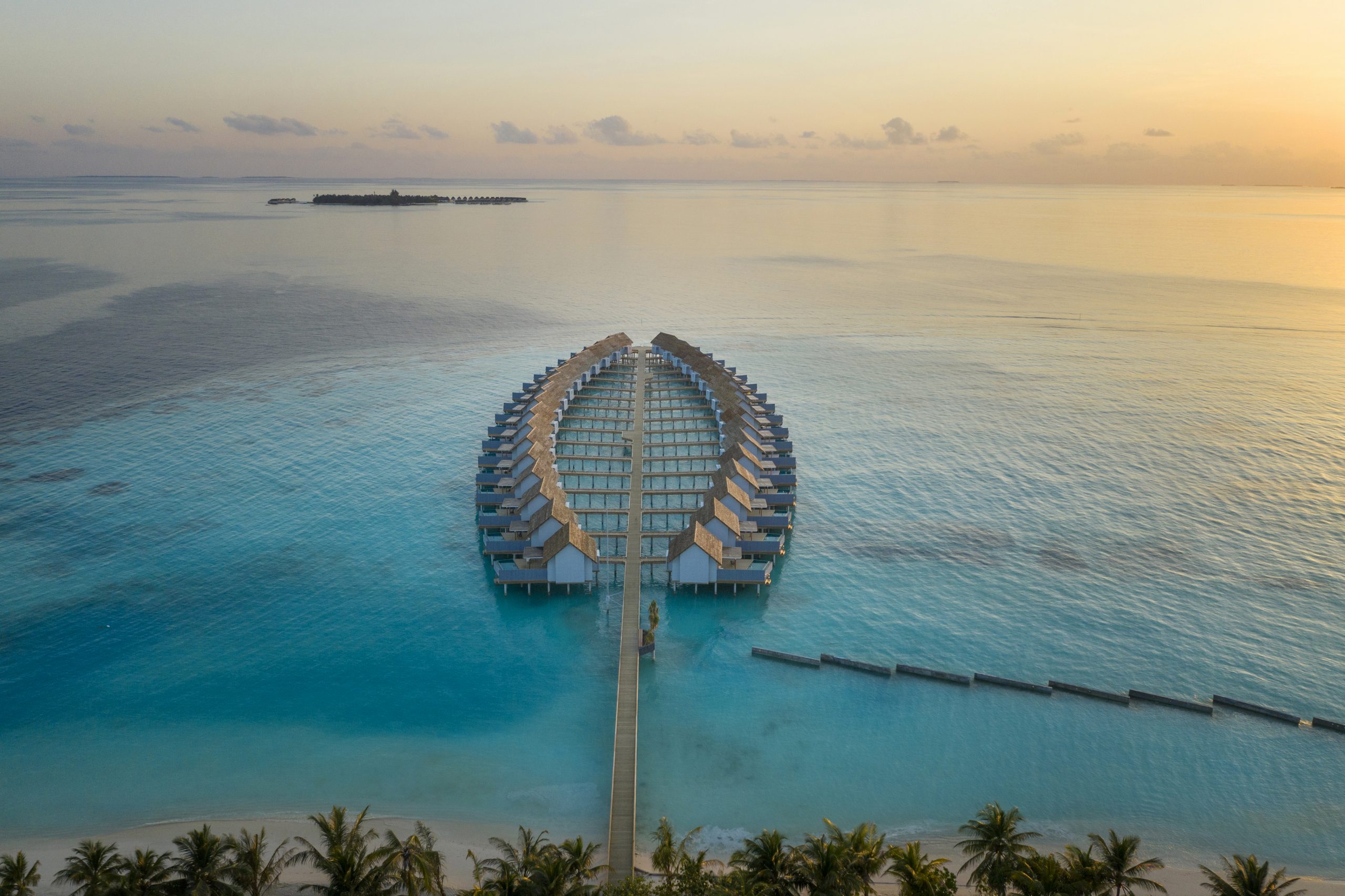 outrigger-maldives-maafushivaru-resort-water-villas-aerial1
